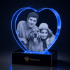 Heart-shaped 3D crystal keepsake displaying a couple's photo for a 1st anniversary gift for her