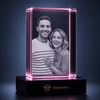Personalized 25th anniversary photo crystal engraved with a couple's portrait on a shelf