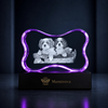 Memirova Faceted Bone Crystal Memorial Keepsake, shown illuminated on an optional LED light display base