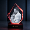 Memirova Faceted Prestige Crystal Memorial Keepsake, displayed on a shelf as part of a home memorial display