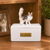 Memirova Custom Clay Figurine Memorial Urn, displayed on a shelf as part of a home memorial display
